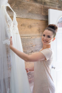 bride getting her dress in the bridal suite at cherry barc farm