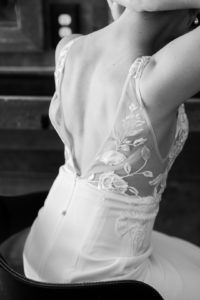 up close of brides dress in black and white